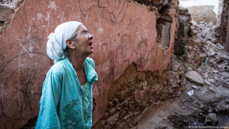 A women cries out among buildings damaged by the earthquake that struck Morocco on 8 September 2023 (image: Fadel Senna/AFP/Getty Images)