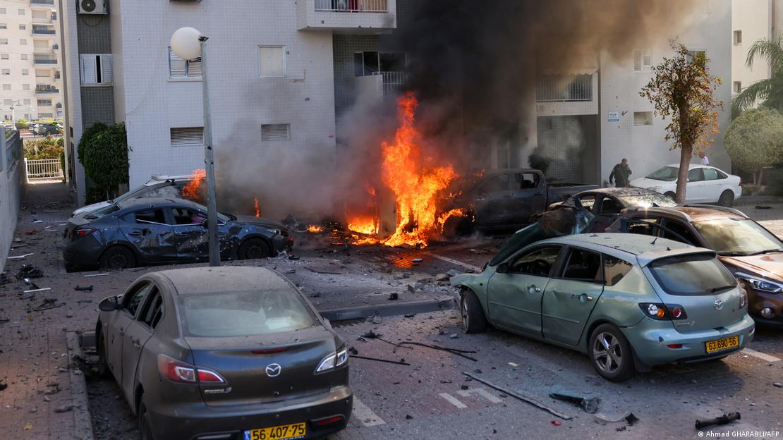 Burnt out vehicles in Ashkelon, Israel, after a rocket attack from the Gaza Strip (image: Ahmed Gharabli/AFP)