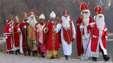Actors dressed as Saint Nicholas in procession