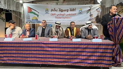 A group of men are sitting in a desk, and another seems giving a speech. (Photo: Mohamed Solaimane)