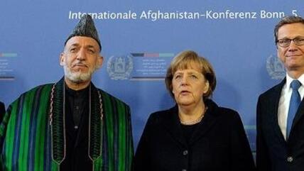 Family photo with Hamid Karzai, Angela Merkel and Guido Westerwelle at the Afghanistan Conference in Bonn (photo: dapd)