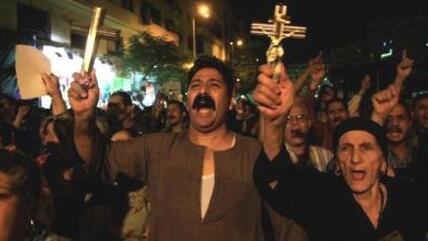 In this Tuesday, Oct. 4, 2011 file photo, Egyptian Copts hold Christian crosses and chant slogans as they demonstrate against the sectarian violence, in downtown Cairo, Egypt (photo: dapd)