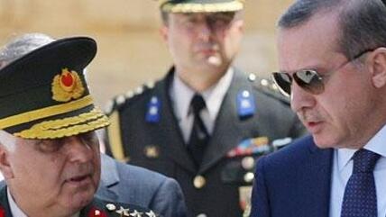 Prime Minister Recep Tayyip Erdogan, right, talks with Gen. Necdet Ozel, Turkey's new Land Forces Commander and acting Chief of Staff, at the mausoleum of modern Turkey's founder Kemak Ataturk, after the military's annual meeting in Ankara, Turkey, Monday, 1 August 2011 (photo: AP)