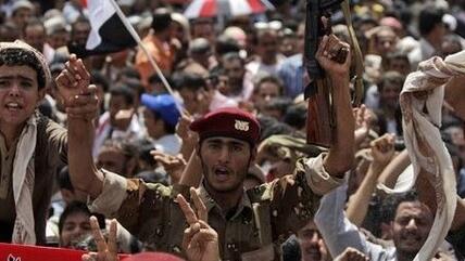 A jubilant crowd in Yemen's capital, Sanaa, after the news broke President Saleh had left the country (photo: AP)
