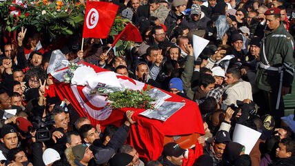 Mourners carry the coffin of slain opposition leader Chokri Belaid during his funeral procession towards the nearby cemetery of El-Jellaz in Tunis, February 8, 2013 (photo: Reuters)