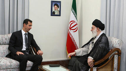 Syria's President Bashar al-Assad speaking to Ayatollah Ali Khamenei during a state visit to Tehran (photo: AP)