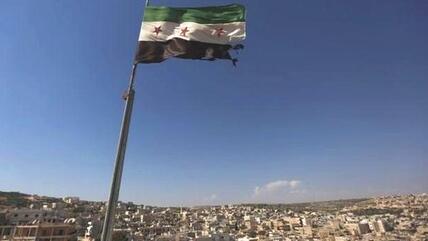 Rebel Flag over Aleppo (photo: AP)