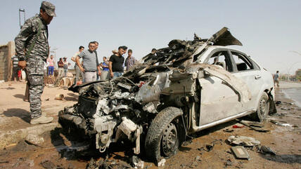 The wreckage of a bombed-out car in Kirkuk, 23 July 2012 (photo: Reuters)