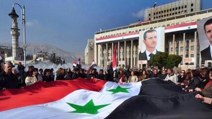 Pro-Assad rally in Damascus (photo: AP)