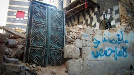 عدسة شاب حمصي: صور فوتوغرافية توثق دمار حمص وتتحدى خطر الموت