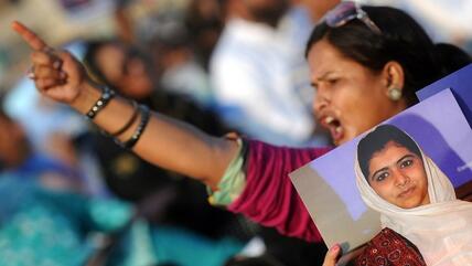 A Pakistani female supporter of a political party Muttahida Quami Movement (MQM) shouts slogans during a protest procession against the assassination attempt by Taliban on child activist Malala Yousafzai in Karachi on October 14, 2012 (photo: AFP/Getty)
