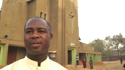 Peter Ebidero, Vicar general in front of the Catholic church in Kano (photo: dpa)
