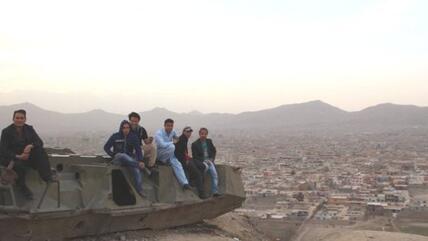 Afghans sitting on an old Soviet tank (photo: Marian Brehmer)
