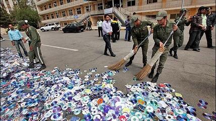 Officials sweeping up CDs and DVDs in Iran (photo: MEHR)