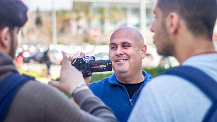 Corey Gil-Shuster, director of the International Program in Conflict Resolution and Mediation at Tel Aviv University, during filming.