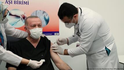 Turkish President Recep Tayyip Erdogan is filmed receiving a coronavirus vaccination.
