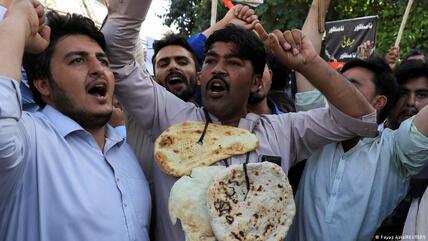 Pakistan is facing a severe economic crisis, with many citizens finding it difficult to make ends meet. Here, men in Peshawar demonstrate against a surge in fuel prices in June 2022.