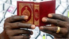 African Muslim man reading the Koran