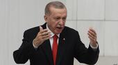 Turkish President Recep Tayyip Erdogan gesticulates during a speech to parliament