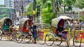 Rickshaw pullers rest from the heat in Dhaka 