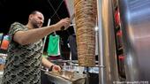 Ahmed Awad prepares the meat in a Palestinian restaurant in Cairo