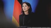 Germany's Foreign Minister Annalena Baerbock is seen standing in front of a German flag at a press conference, Berlin, Germany, 16 April 2024