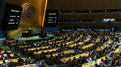 View of the UN General Assembly and a screen showing the results of the vote