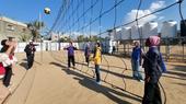 A group of women playing volleyball.