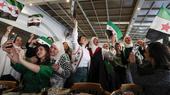Syrian women celebrate the fall of the Assad regime. 