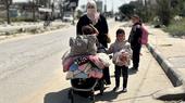 A woman seen in a street with her three kids.