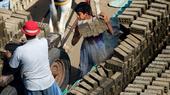 In this Oct. 17, 2012 photo, an Egyptian child loads a cart with cement bricks in a brick factory at the outskirts of Qalyobiya, 45 kilometers (27 miles) north of Cairo, Egypt. (Photo: Picture Alliance / AP | Khalil Hamra)