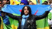 In this April 22, 2012, photo, an activist carries the Berber flag during a march calling for greater rights and autonomy in the Moroccan city of Casablanca, April 2012.