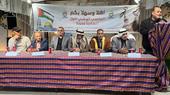 A group of men are sitting in a desk, and another seems giving a speech. (Photo: Mohamed Solaimane)