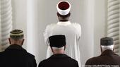 Crimean Tatar men pray at a mosque in Bakhchysarai. 