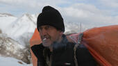 After a short cigarette break, a fully laden kolbar sets out on the final leg of the journey. Exposure to the mercy of the elements is not the only risk for kolbars, who are regularly monitored and frequently shot at by Iranian border patrol officers 