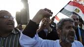 Egyptians waving an Egyptian flag demonstrate against the Muslim Brother Mohammed Morsi