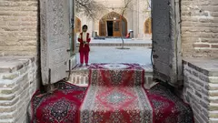 A girl waits on the threshold of the mausoleum of Sheikh Ahmad e-Jam in the north-east Iranian city of Torbat e-Jam