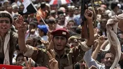A jubilant crowd in Yemen's capital, Sanaa, after the news broke President Saleh had left the country (photo: AP)