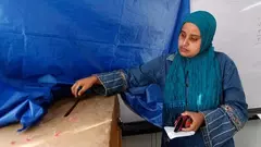 An Egyptian woman casts her vote at a polling station during the Egyptian parliamentary elections in Alexandria (photo: AP)