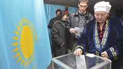 A Kazakh woman casts her ballot at a polling station in the Kazakhstan's commercial capital Almaty (photo: AP)