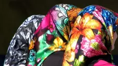 Three women wearing fashionable headscarfs (photo: Wikipedia)