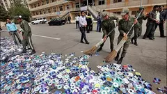 Officials sweeping up CDs and DVDs in Iran (photo: MEHR)