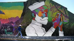 The Woodstock district of Cape Town, South Africa, is known for being hip and is one of the best street art locations in South Africa. Here, a wall painting shines with all its colours and grace in the multicultural neighbourhood.