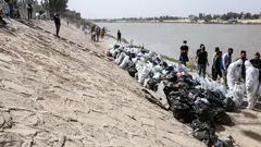 Young Iraqi volunteers take part in a cleanup campaign on the banks of the Tigris River, a rare environmental project in the war-battered country.