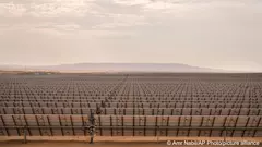 From a distance, the endless landscape of solar panels stretching toward the horizon can easily be mistaken for crops nearing harvest. But here in the desert in southern Egypt, workers have been cultivating another precious commodity: electricity.