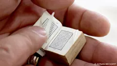 For generations, the postage stamp-sized Koran has been passed down through one family -- surviving wars and one of the world's most fanatical "godless regimes".