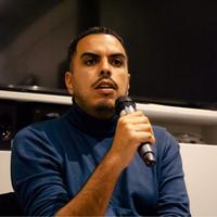 A man holding a microphone.