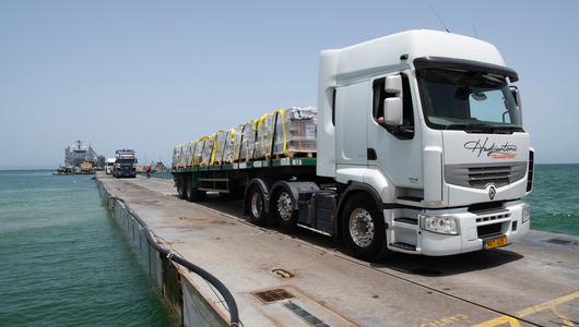 Truck with humanitarian aid standing on the pier in Gaza