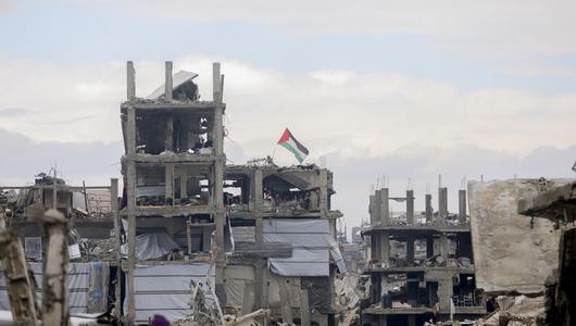 A row of destroyed multistory buildings.