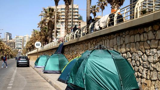 Displaced people live in tents along the seaside of Ramlet al-Baida on the Beirut Corniche in Beirut, Lebanon, on March 12, 2026, near the site where an Israeli strike reportedly targeted people sheltering in tents.
